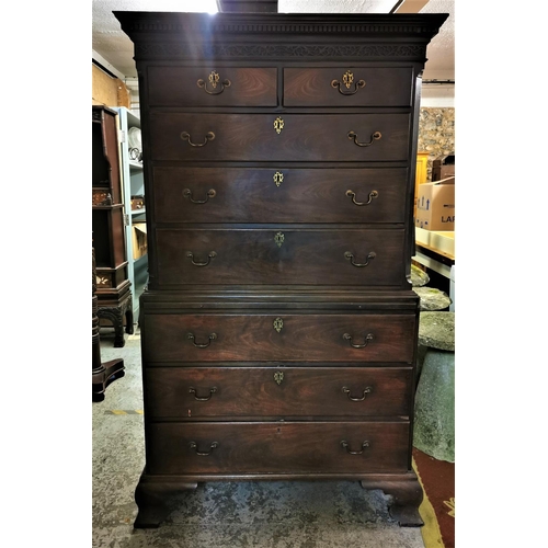 186 - A late Georgian mahogany chest on chest, with moulded dentil cornice above a carved fretwork frieze,... 