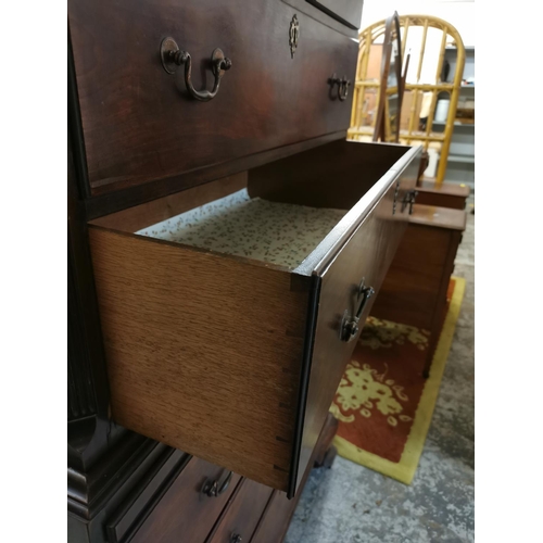 186 - A late Georgian mahogany chest on chest, with moulded dentil cornice above a carved fretwork frieze,... 