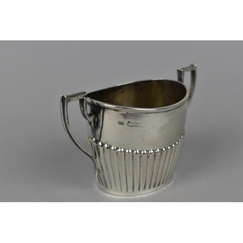 96 - A late Victorian silver teapot and sugar bowl by Robert Pringle & Sons, London 1899, with part flute... 