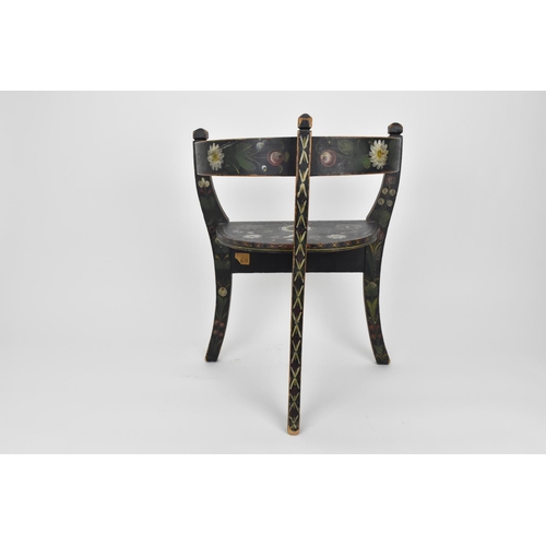 196 - A Norwegian folk art painted and stained wooden chair with horse shoe back, on three legs, designed ... 