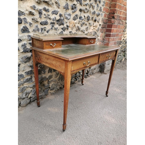 158 - An Edwardian mahogany and strung writing desk, with pierced part gallery top above a single drawer e... 