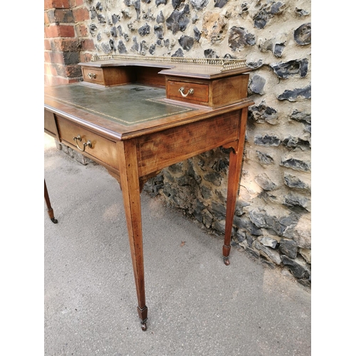 158 - An Edwardian mahogany and strung writing desk, with pierced part gallery top above a single drawer e... 