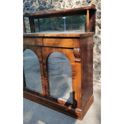 177 - A William IV rosewood chiffonier, with mirrored back , the bottom part with twin doors, each with ar... 