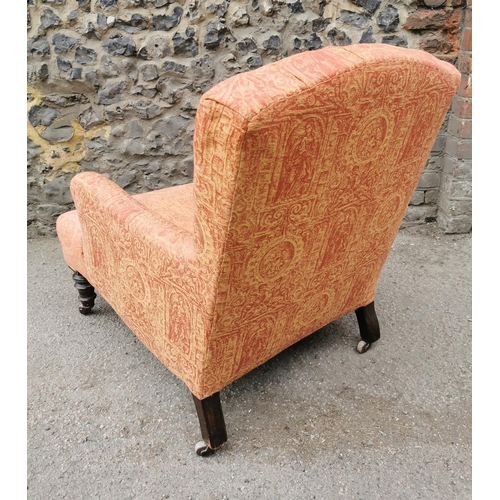 194 - A Victorian walnut and upholstered Howard style armchair, the buttoned back seat upholstered with Cl... 