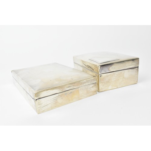 89 - Two silver cased cigarette boxes, one engine turned, 16.5cm wide and 13cm wide

Condition: marks rub... 