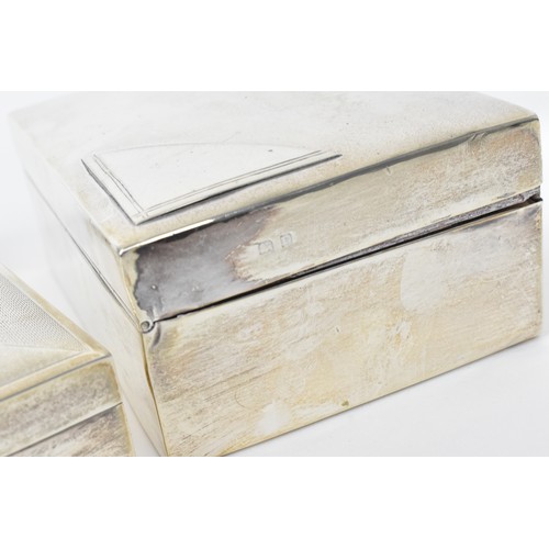 89 - Two silver cased cigarette boxes, one engine turned, 16.5cm wide and 13cm wide

Condition: marks rub... 