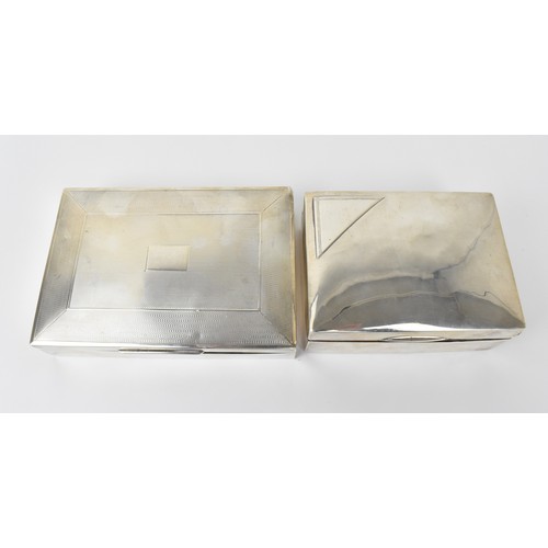 89 - Two silver cased cigarette boxes, one engine turned, 16.5cm wide and 13cm wide

Condition: marks rub... 