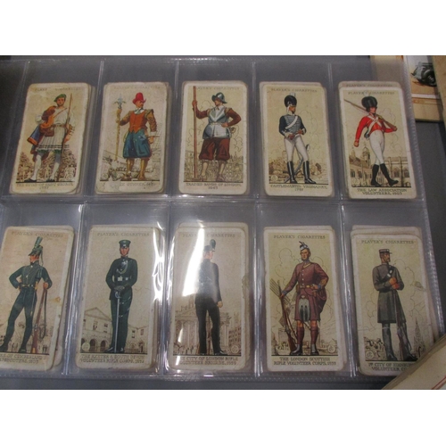 A collection of cigarette card album to include 1939 Gallagher Army Badge  cards, 1939 Players Unifor