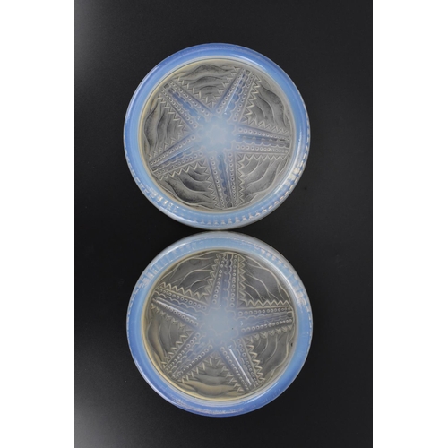 41 - A pair of Sabino style opalescent glass coasters, of circular form with central starfish pattern, ea... 