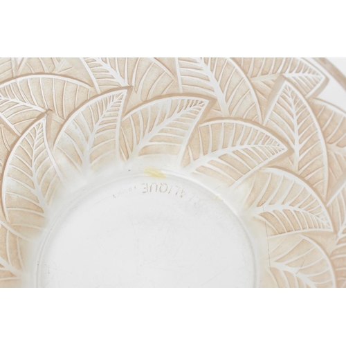 8 - A Rene Lalique frosted and clear pink tinted bowl in the 'Ormeaux' pattern, the underside stencilled... 