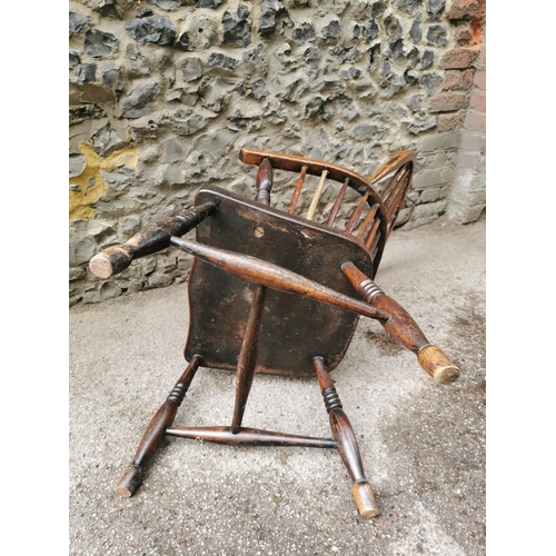 185 - A 19th century ash and elm windsor armchair, with hooped back with central pierced back, flanked wit... 