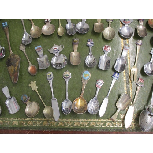 29 - Vintage caddy spoons, some with enamelled tourist emblems together with white metal items and a silv... 