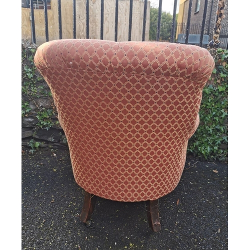 190 - A Victorian upholstered Howard style armchair, with button back, deep seat, supported on turned legs... 