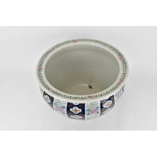 196 - A Chinese late Qing dynasty porcelain jardiniere, with applied enamel flowers and trailing foliage, ... 