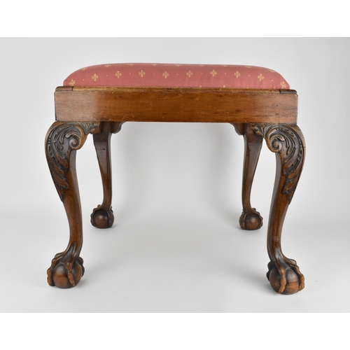 197 - A fine George II style carved walnut stool, 19th century, with drop in upholstered seat, raised on f... 