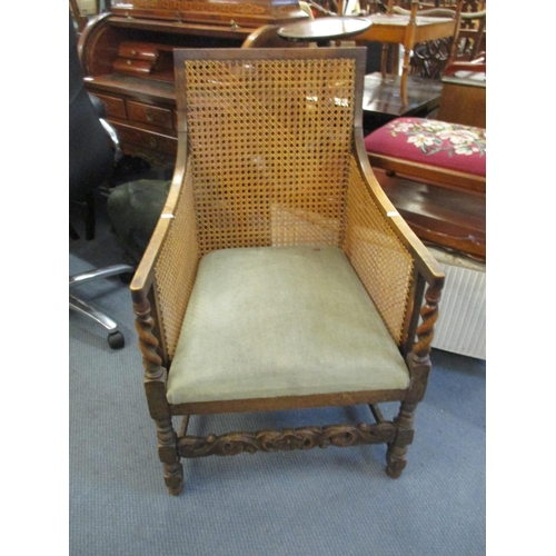 65 - An early 20th century caned oak armchair
Location: C-L