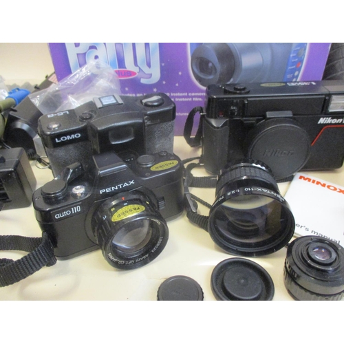 67 - Cameras to include a boxed Fiji Big Party Plus, with Instax 200 camera, a Nikon AFL35, a Zenith Lomo... 