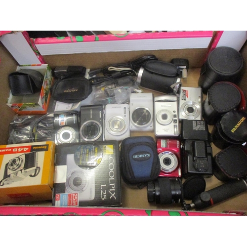 68 - Cameras to include modern digital Samsung, Nikon and Canon cameras with mixed accessories
Location: ... 