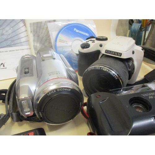 69 - Cameras and photographic equipment to include a Panasonic Digital video camera with Leica Dicomar le... 