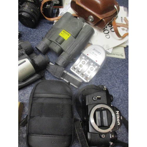 72 - Cameras and photographic equipment to include vintage Kodaks, a Nikon EM modern digital cameras, acc... 