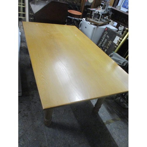 78 - A light oak contemporary kitchen table on turned legs, 75 x 180 x 100.5cm and a Bradley reproduction... 