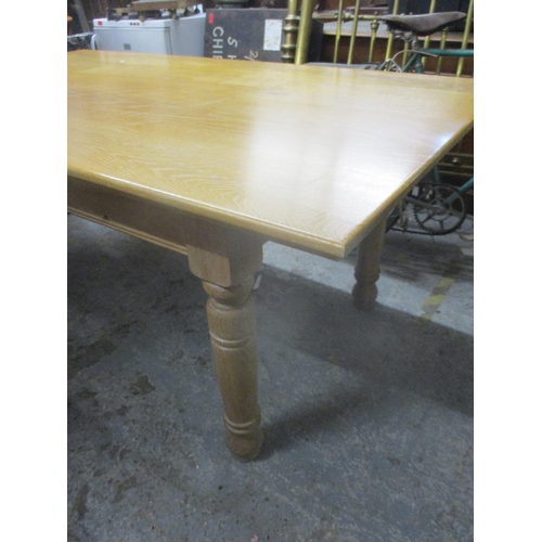 78 - A light oak contemporary kitchen table on turned legs, 75 x 180 x 100.5cm and a Bradley reproduction... 