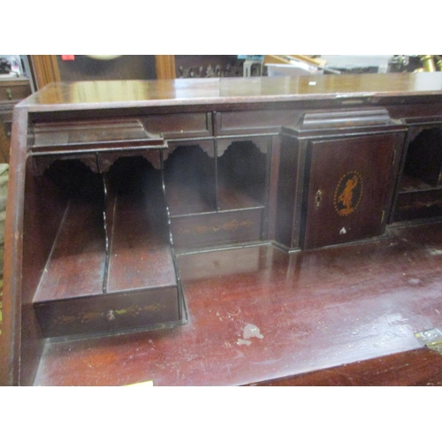 79 - A Georgian mahogany bureau, the flame mahogany fall flap with gadroon edge revealing a pigeon hole i... 