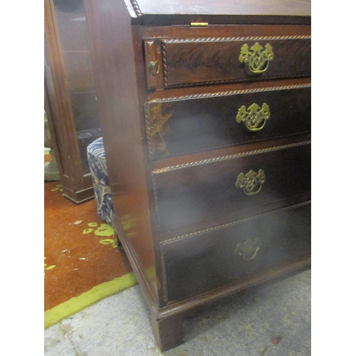 79 - A Georgian mahogany bureau, the flame mahogany fall flap with gadroon edge revealing a pigeon hole i... 