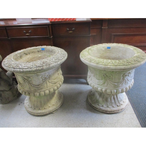 87 - A pair of large composition stone garden urns with ribbon and swag ornament 61cm h x 62cm d
Location... 