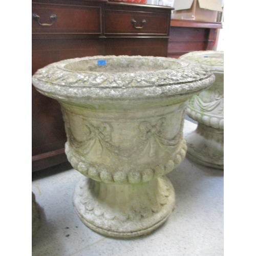 87 - A pair of large composition stone garden urns with ribbon and swag ornament 61cm h x 62cm d
Location... 