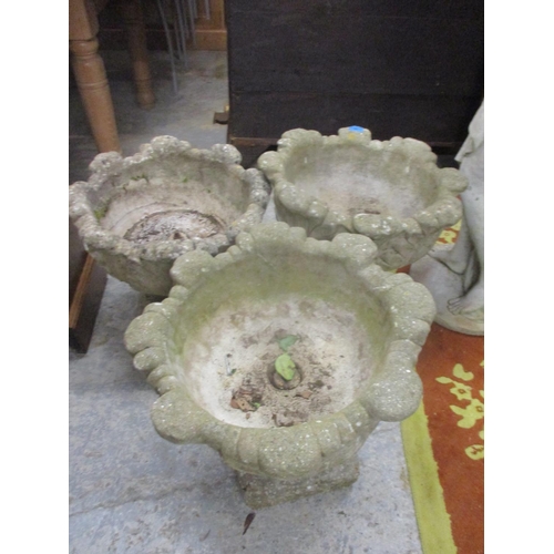 90 - A pair of composition stone garden platers, on pedestal bases and one other 46cm high
Location: G