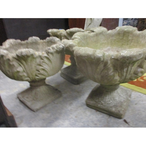 90 - A pair of composition stone garden platers, on pedestal bases and one other 46cm high
Location: G