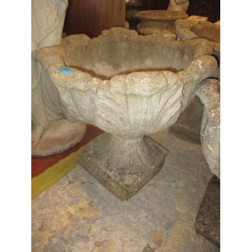 90 - A pair of composition stone garden platers, on pedestal bases and one other 46cm high
Location: G