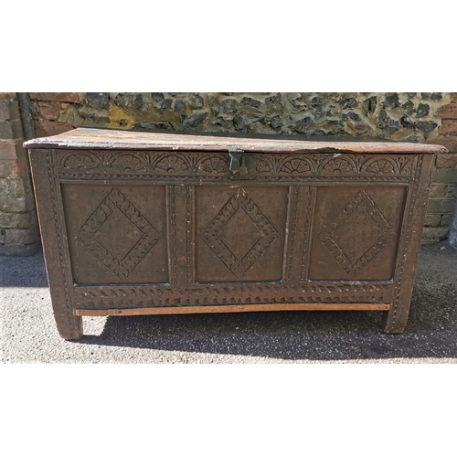 188 - A late 17th century oak coffer, with carved floral frieze above three carved lozenge panels, 64 cm h... 