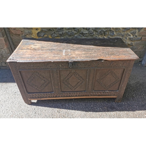 188 - A late 17th century oak coffer, with carved floral frieze above three carved lozenge panels, 64 cm h... 