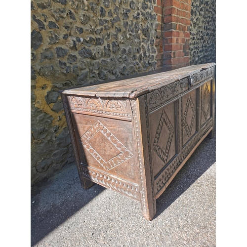 188 - A late 17th century oak coffer, with carved floral frieze above three carved lozenge panels, 64 cm h... 