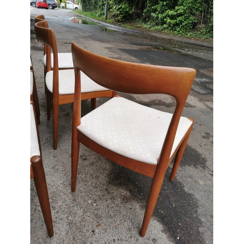 44 - A 1960s Danish teak extending table and chairs by Skovmand & Andersen, the circular table with two a... 