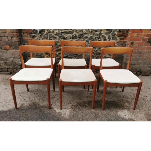 44 - A 1960s Danish teak extending table and chairs by Skovmand & Andersen, the circular table with two a... 