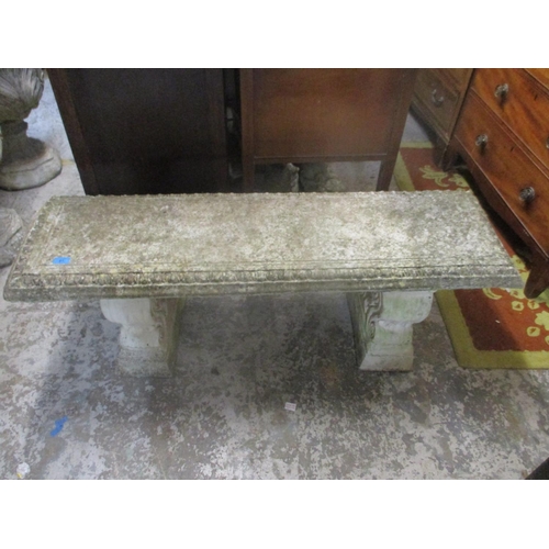 81 - A composition stone garden bench with scroll moulded ends 128cm long
Location: G