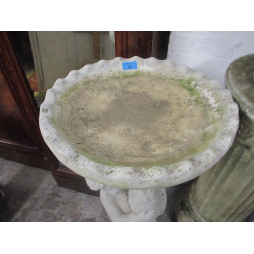 82 - A composition stone birdbath support by a boy Location: G