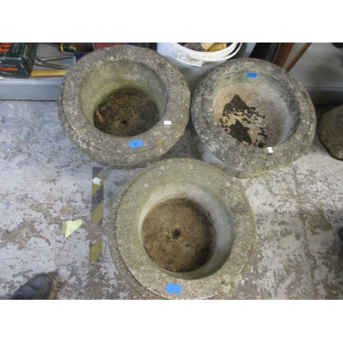 89 - A pair of composition stone garden planters with gadroon ornaments 39cm high x 44cm dia, and one oth... 