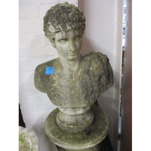 86 - A composition stone garden statue, a classical bust on a socket and plinth with leaf and fluted orna... 