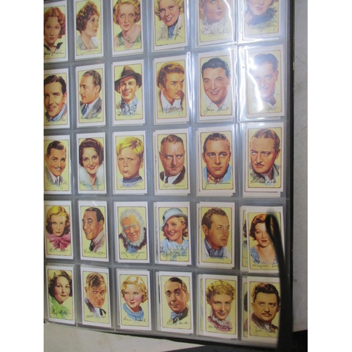 A collection of cigarette cards to include Beatles Warus cards, together  with a large photograph alb