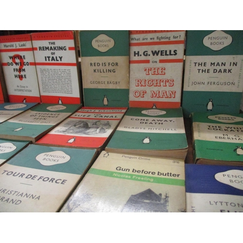 A box of various vintage Penguin and Pelican books to include