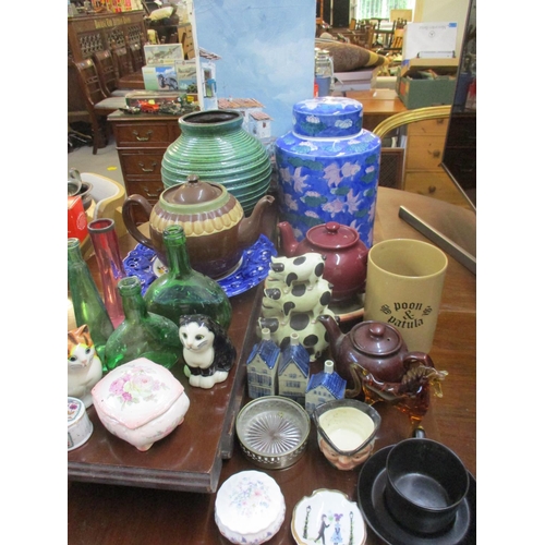 355 - Mixed household items to include ornamental models of cats, a retro glass model of a horse, mixed gl... 