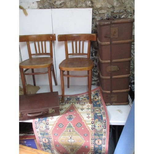 364 - A canvas style trunk, a brown leather suit case, two rugs and two Bentwood style chairs
Location: G