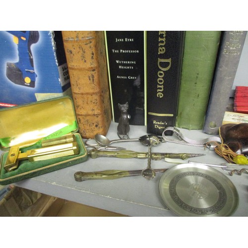 377 - A selection of kitchenalia to include a wooden handled corkscrew, and books to include a leather bou... 