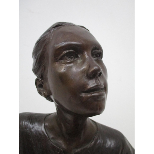 200 - Judith Holmes Drewry - 'Tuesday's Child' a bronze figure of a girl with her hair tied up, wearing a ... 