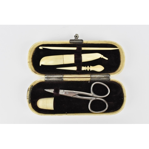 174 - A 19th century ivory sewing kit, the hinged cover opening to reveal a velvet lined fitted interior w... 