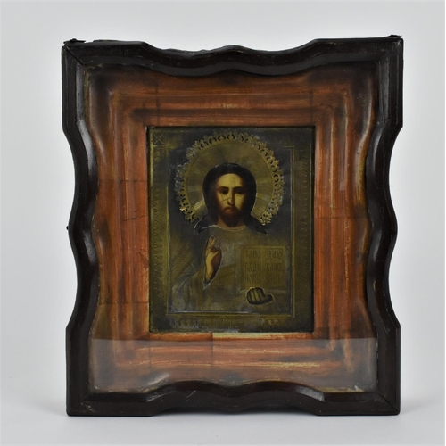 175 - A 19th century Russian icon of Christ Pantocrator, with gilt metal oklad, encased in a glazed shaped... 